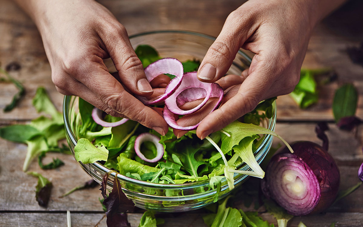 Hands Preparing Salad