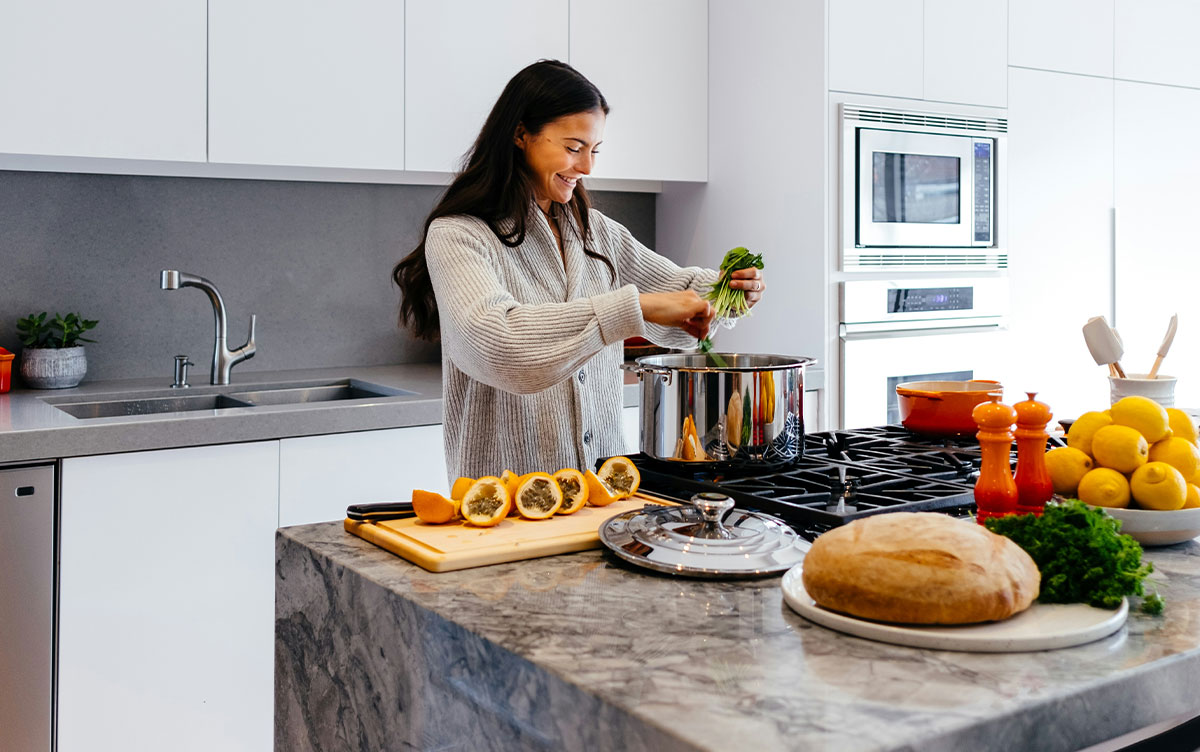 Woman Cooking in Kitchen